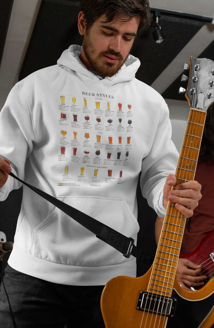 a man with a guitar wearing different beer styles hoodie