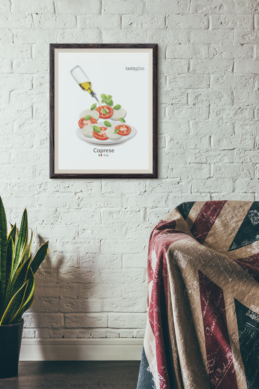 caprese poster hanging on a white brick wall