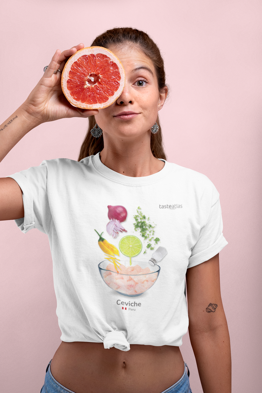 woman standing in front of a pink wall wearing ceviche t-shirt