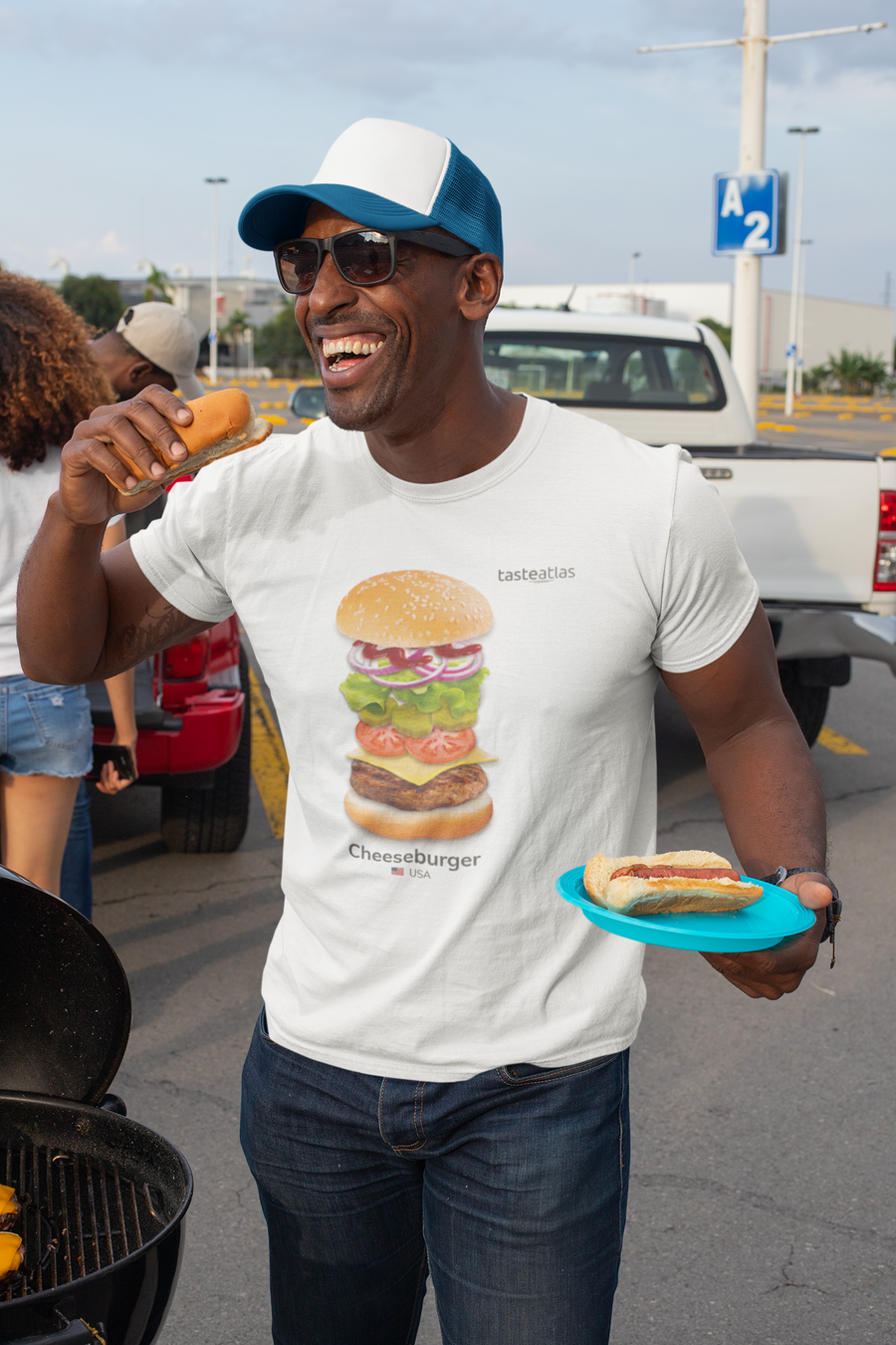 a man eating hot dog wearing cheeseburger t-shirt