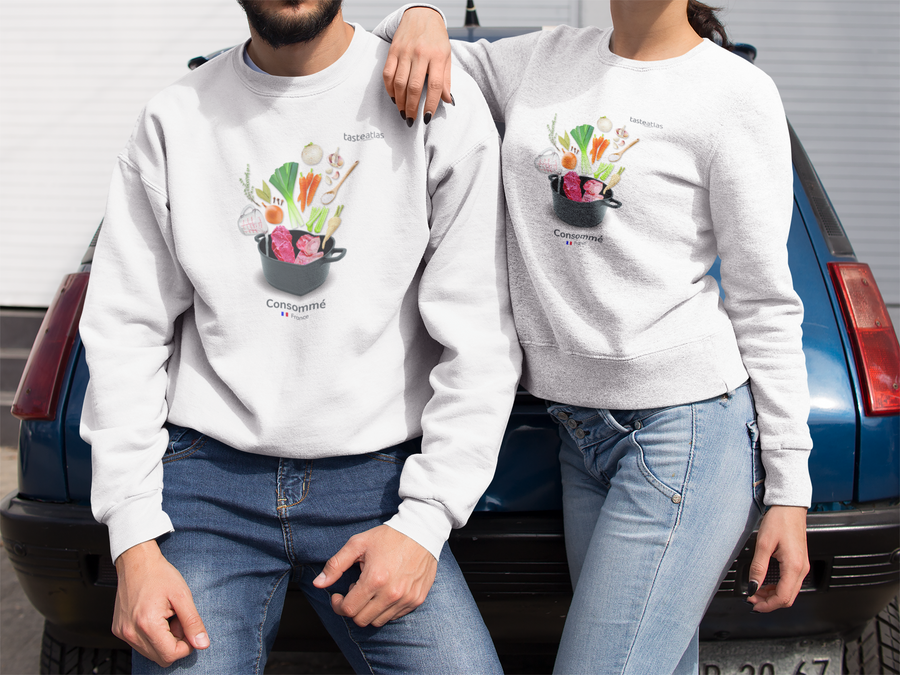 man and woman leaning on a car wearing consomme sweatshirts