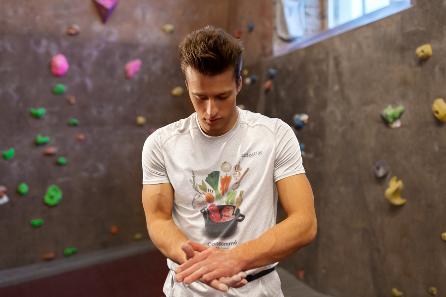 indoor rock climbing man wearing consomme t-shirt