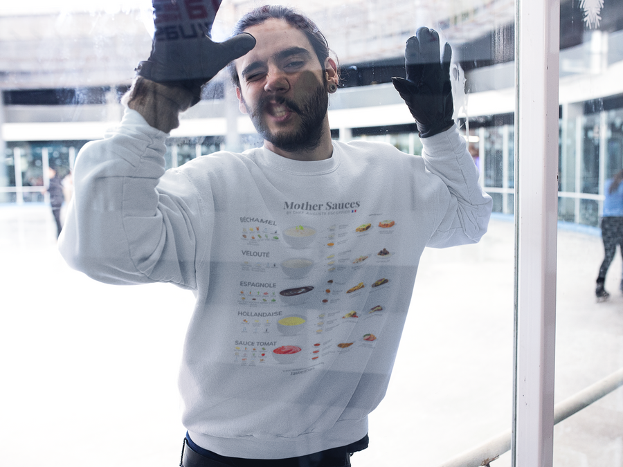 a man fooling arronud on a window wearing mother sauces by chef auguste escoffier sweatshirt