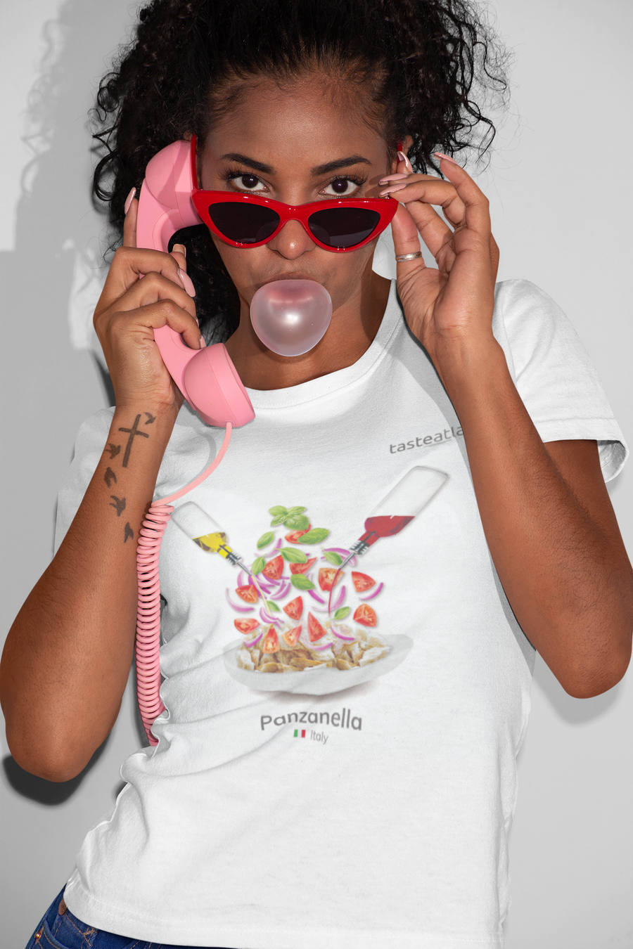 woman witha a telephone and sunglasses wearing panzanella t-shirt