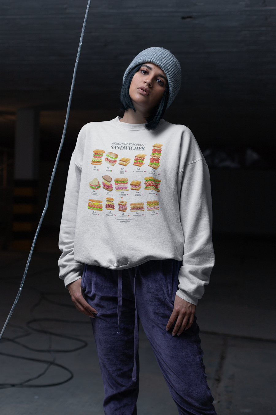 woman in an underground warehouse wearing world's most popular sandwiches sweatshirt
