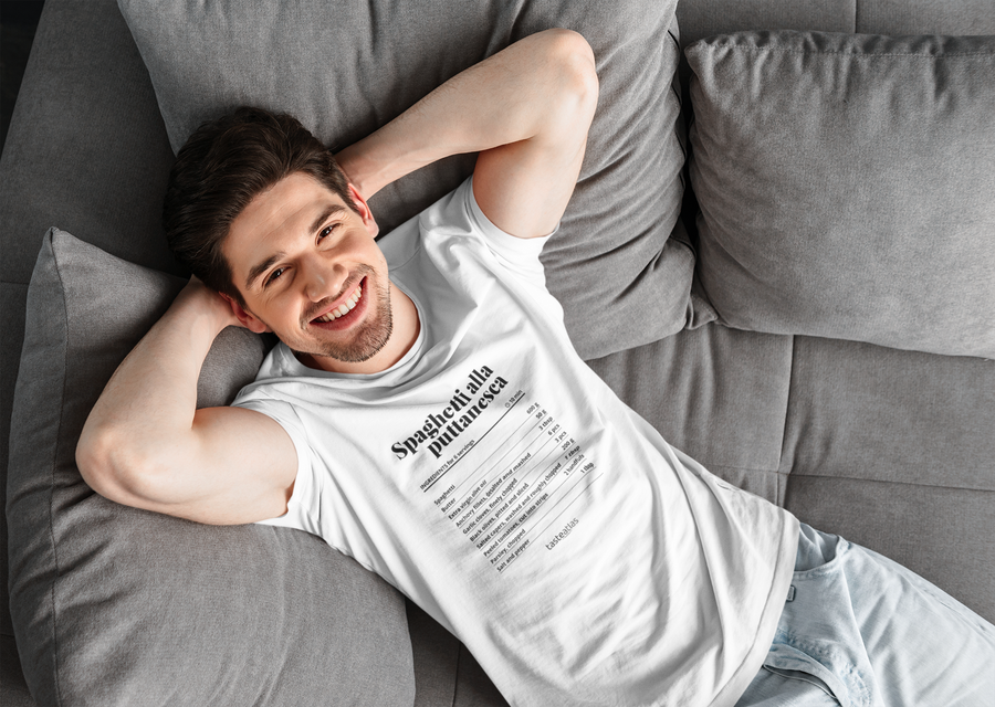 a man laying on a sofa wearing spaghetti alla puttanesca recipe t-shirt