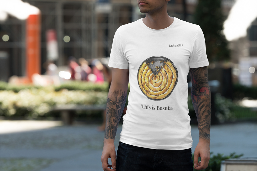 tattooed man wearing this is bosnia t-shirt